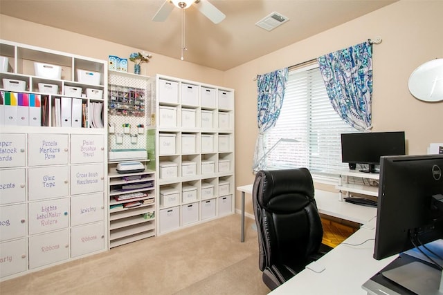 carpeted office with ceiling fan