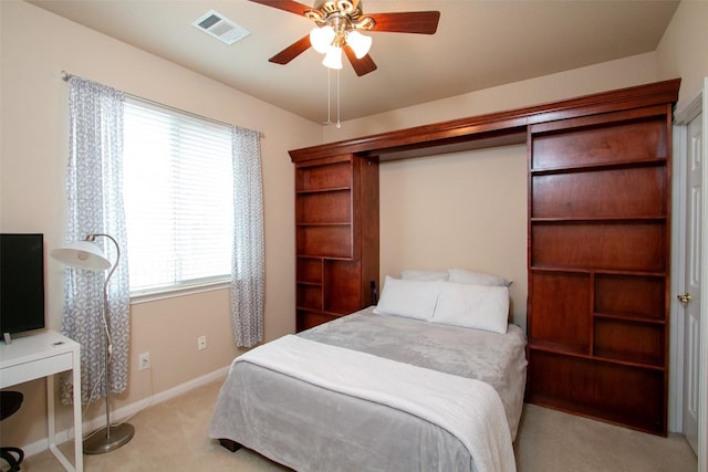 carpeted bedroom with ceiling fan