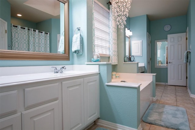 bathroom featuring tile patterned flooring, vanity, and curtained shower