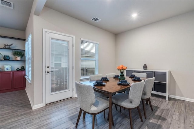 dining area featuring light wood-type flooring