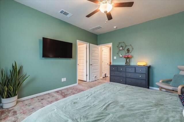 bedroom featuring ceiling fan and light carpet