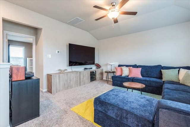 carpeted living room with vaulted ceiling and ceiling fan