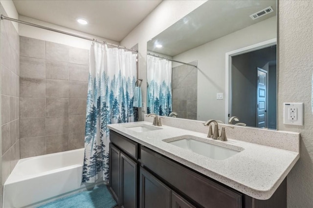 122 Fairmeadow Downs Dr, Hutto, TX 78634 - full bathroom featuring shower / tub combo with curtain, visible vents, a sink, and double vanity