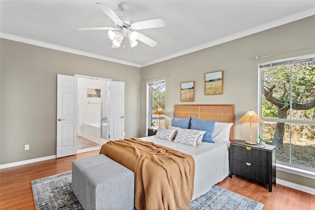 bedroom featuring hardwood / wood-style flooring and multiple windows