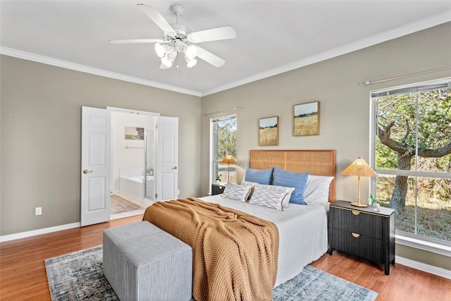 1001 Springlake Dr, Dripping Springs, TX 78620 - bedroom featuring multiple windows, baseboards, crown molding, and light wood finished floors