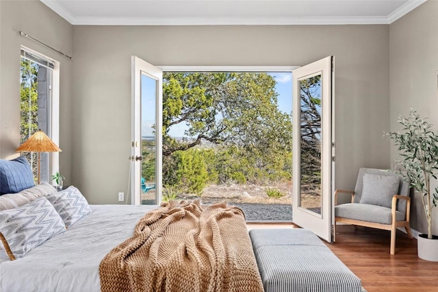 bedroom with crown molding and hardwood / wood-style flooring