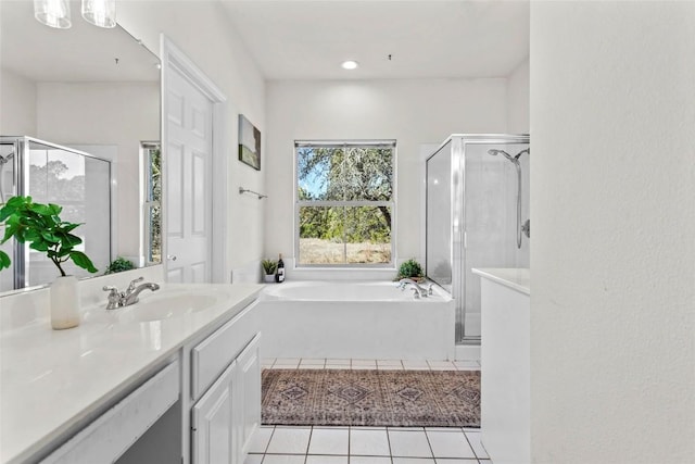 bathroom with vanity, independent shower and bath, and tile patterned flooring