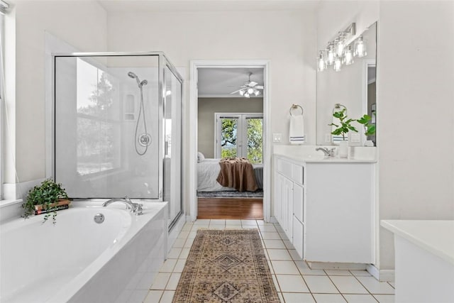 1001 Springlake Dr, Dripping Springs, TX 78620 - ensuite bathroom featuring a garden tub, vanity, a shower stall, and ceiling fan