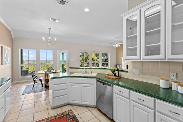 1001 Springlake Dr, Dripping Springs, TX 78620 - kitchen with dishwasher, a sink, a peninsula, decorative backsplash, and white cabinetry
