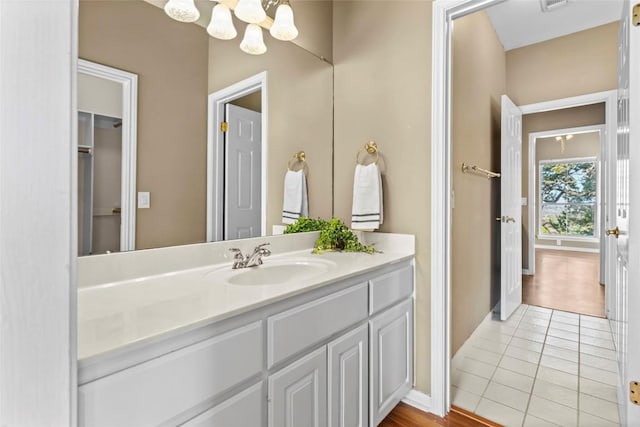 bathroom featuring tile patterned flooring and vanity