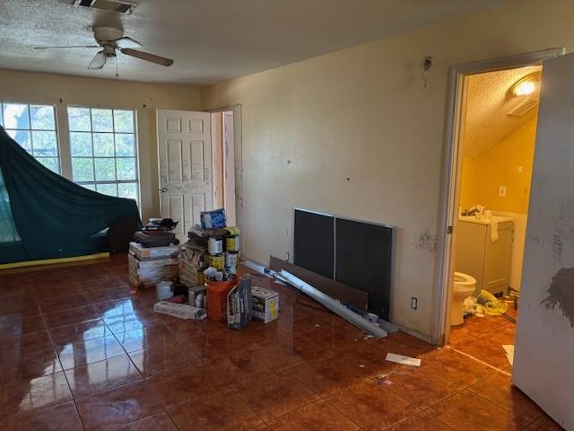 tiled living room featuring ceiling fan