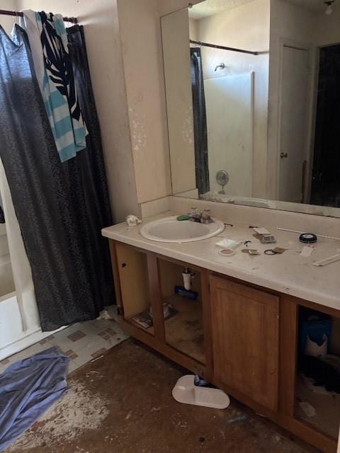 bathroom with vanity and shower / bath combo with shower curtain