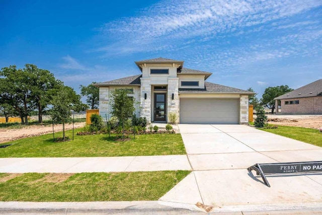 1412 Snowdrop Dr, Georgetown, TX 78628 - view of front facade featuring stone siding, an attached garage, a front lawn, and concrete driveway