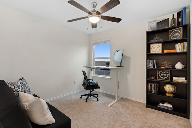 carpeted office featuring ceiling fan