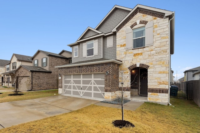 view of front of home with a garage and a front lawn