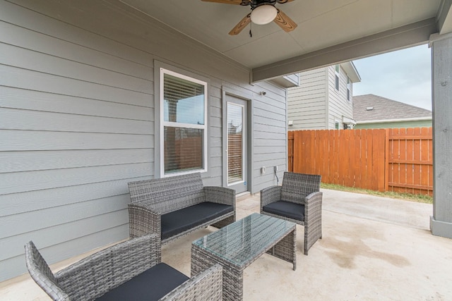 view of patio / terrace with ceiling fan, fence, and an outdoor hangout area