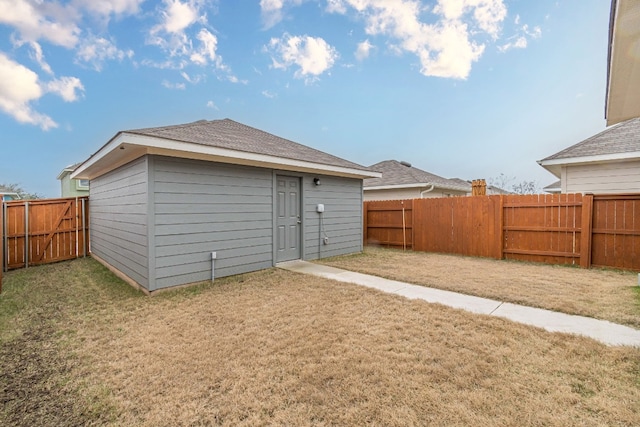 exterior space featuring a lawn and a fenced backyard