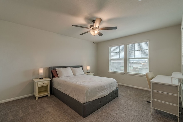 bedroom featuring dark carpet, a ceiling fan, and baseboards