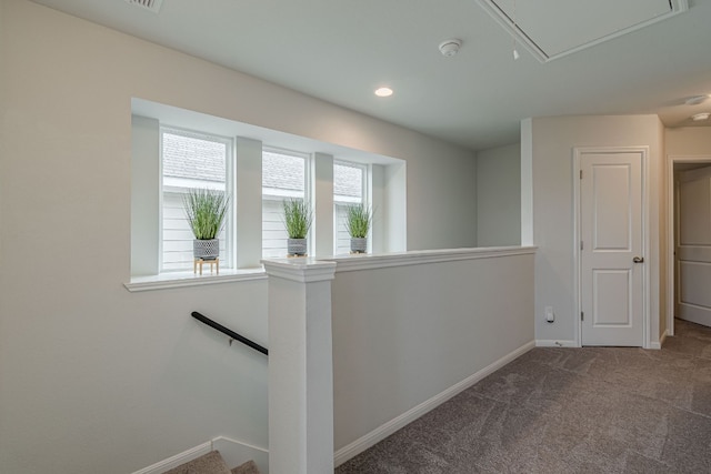 hallway with carpet floors, recessed lighting, attic access, an upstairs landing, and baseboards