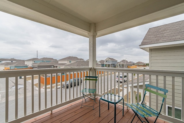 wooden terrace with a residential view