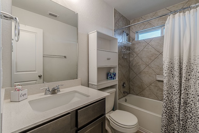 bathroom featuring shower / bathtub combination with curtain, visible vents, vanity, and toilet