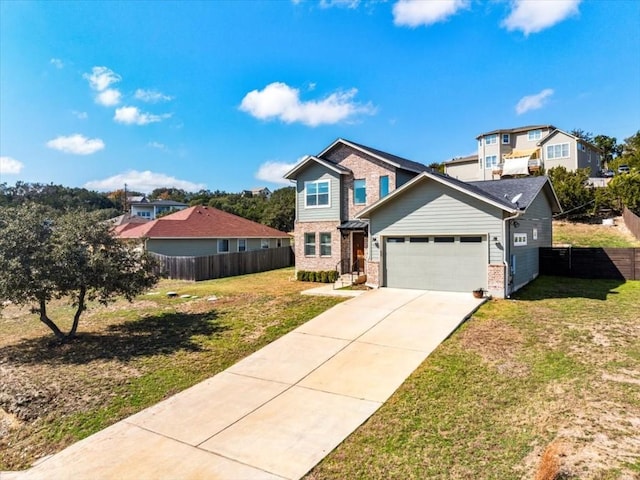 view of front facade with fence, driveway, and a front lawn