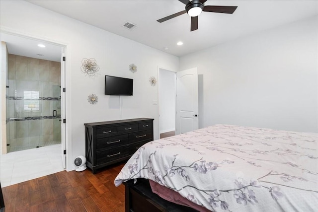 bedroom with ceiling fan, recessed lighting, dark wood-type flooring, visible vents, and ensuite bath