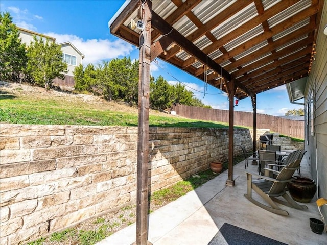 view of patio featuring outdoor dining space and a fenced backyard