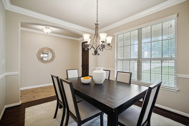 dining room featuring crown molding and dark wood-type flooring