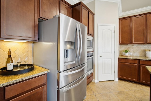 kitchen featuring stainless steel appliances, light tile patterned floors, decorative backsplash, and ornamental molding