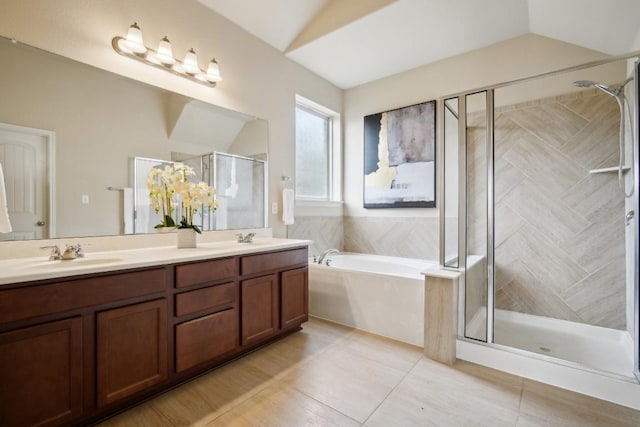 full bathroom with a garden tub, tile patterned flooring, double vanity, a shower stall, and a sink