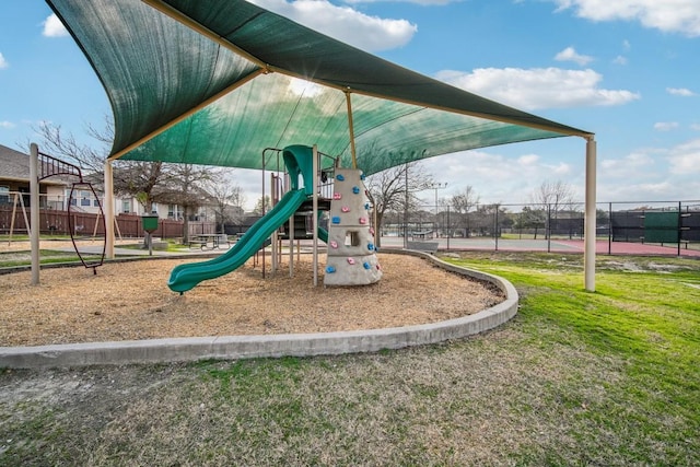 community jungle gym featuring fence