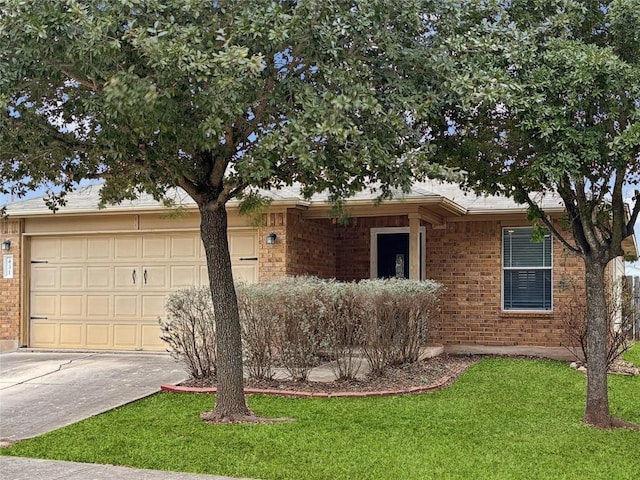 ranch-style house featuring a garage and a front yard