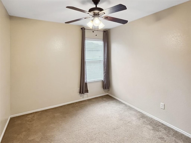 unfurnished room featuring carpet and ceiling fan