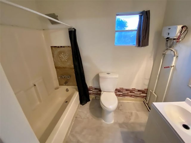 full bathroom with vanity, shower / bath combination with curtain, and toilet