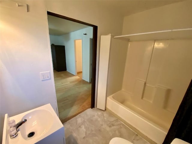 bathroom with vanity and shower / washtub combination