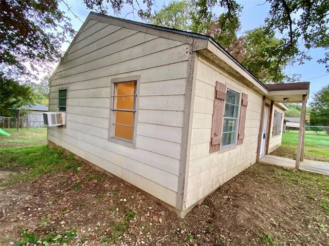 view of home's exterior with cooling unit