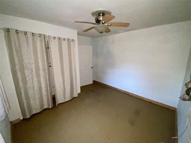 interior space featuring ceiling fan and carpet