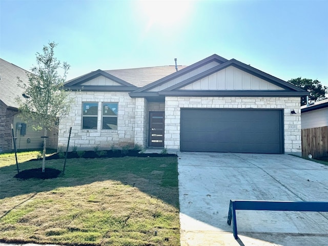 single story home with a garage and a front lawn