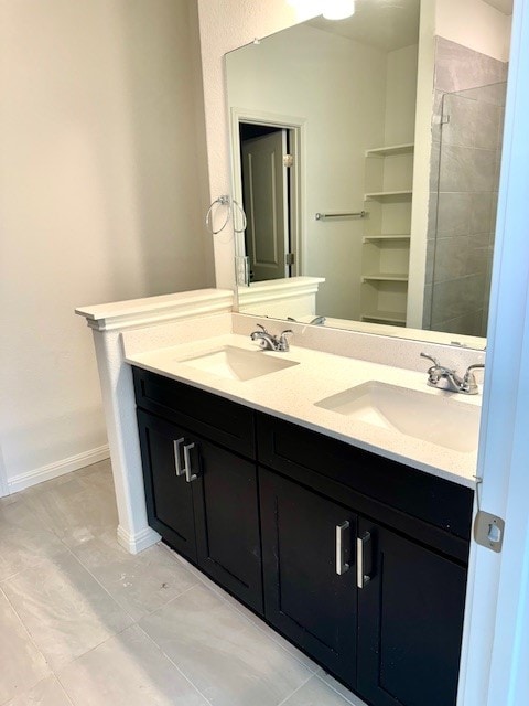 bathroom featuring vanity and a shower