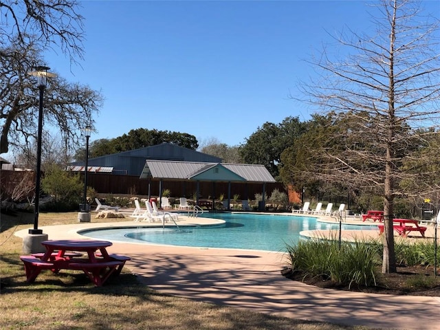 view of swimming pool with a patio