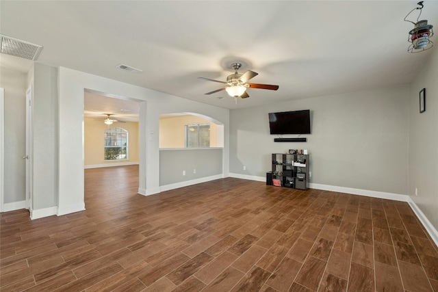 unfurnished living room with ceiling fan and dark hardwood / wood-style floors