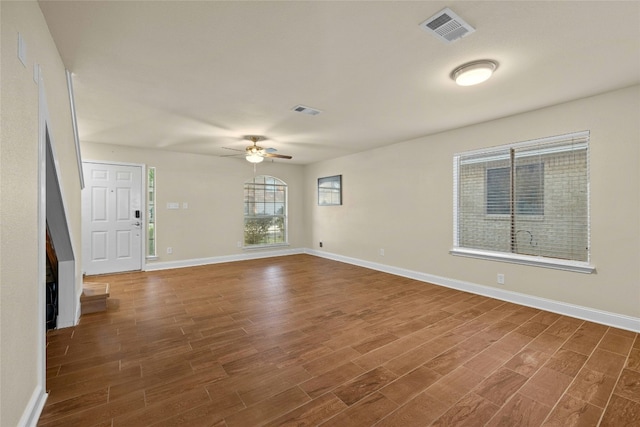 unfurnished room featuring ceiling fan and dark hardwood / wood-style floors