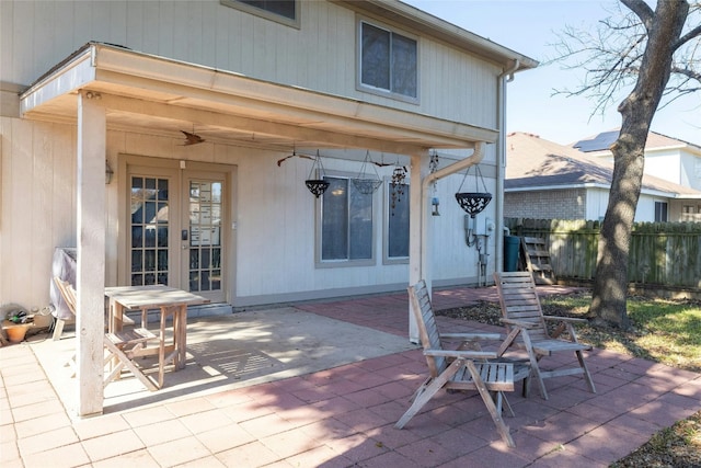 rear view of property with a patio area and french doors