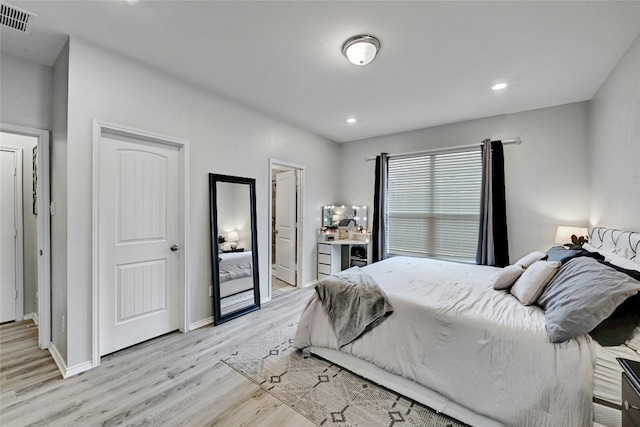 bedroom with light hardwood / wood-style flooring