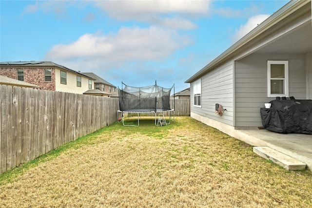 view of yard with a trampoline