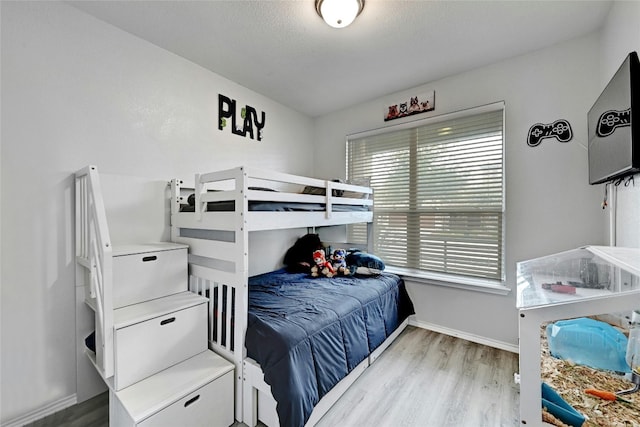 bedroom with light wood-type flooring