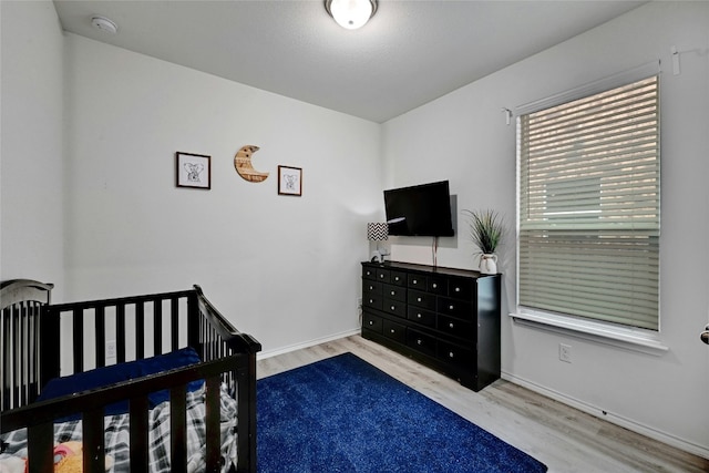 bedroom with light wood-type flooring