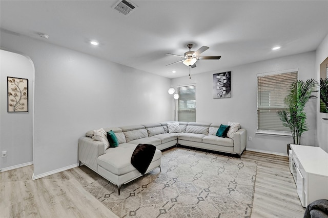 living area with a ceiling fan, visible vents, recessed lighting, and light wood-type flooring