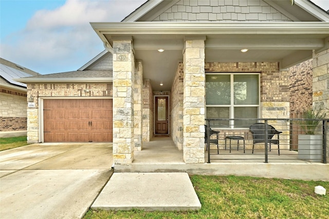 17011 Prestons Braid Ln, Round Rock, TX 78664 - view of exterior entry featuring driveway, an attached garage, covered porch, a shingled roof, and brick siding